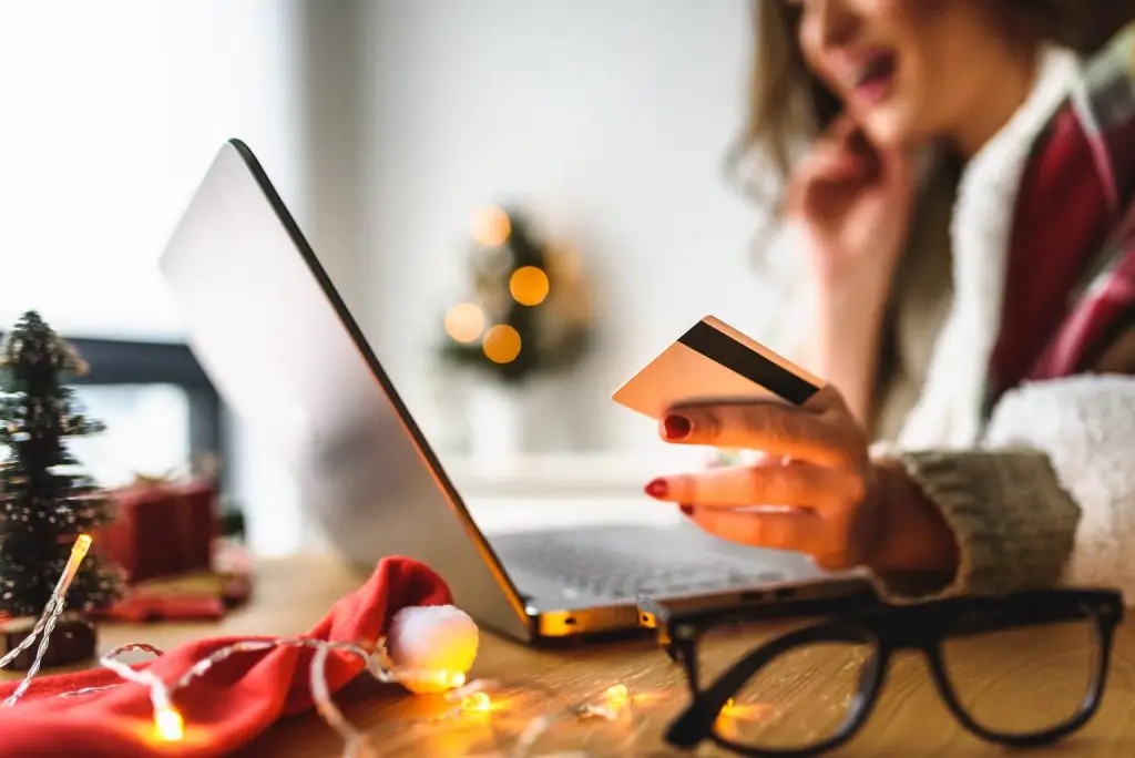 Person using their laptop for holiday shopping
