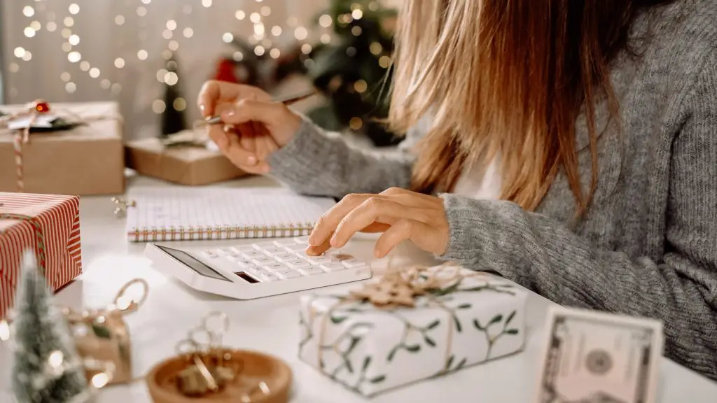 Closeup of a woman writing in a notebook