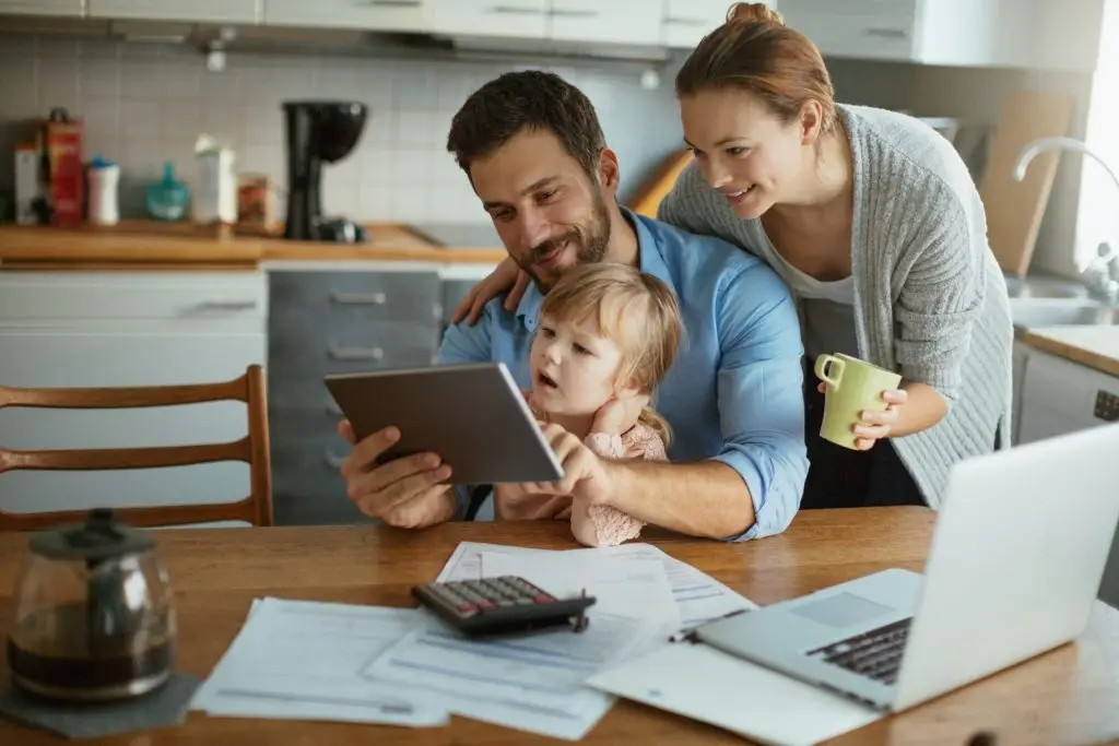 Family looking at a tablet together