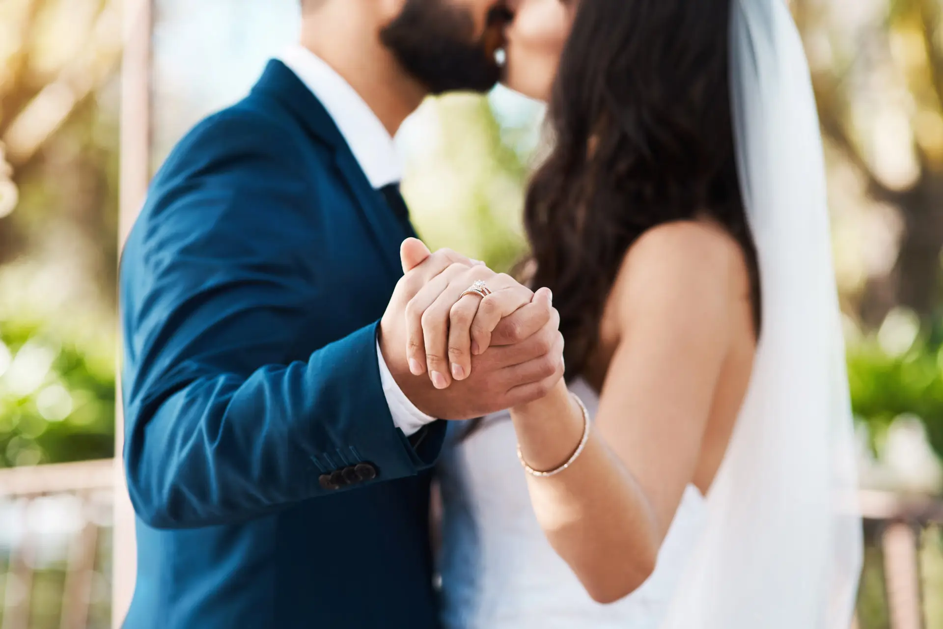 Closeup of bride and groom kissing at their wedding