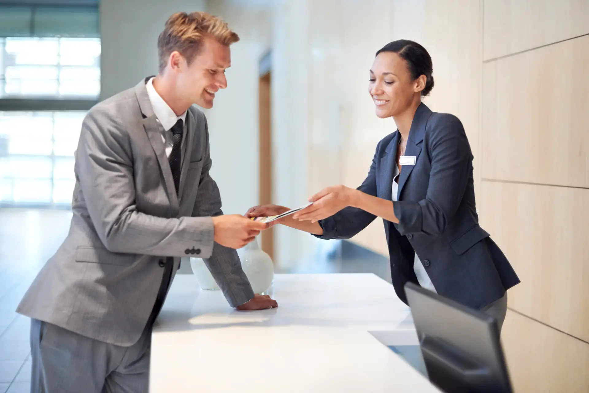 Business man taking something from a credit union representative