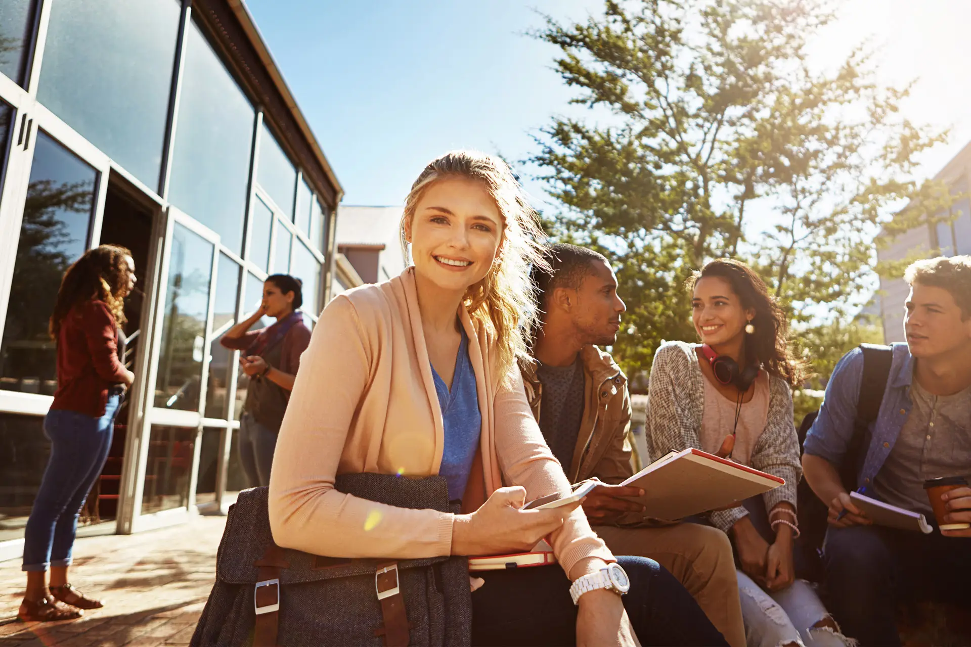 A group of students studying outdoors on campus