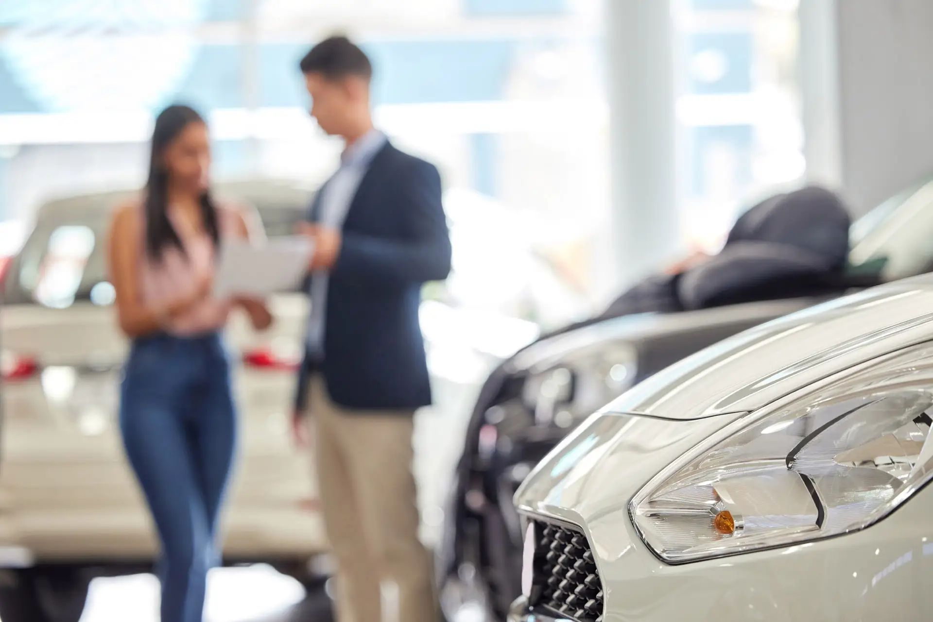 Woman buying a car at a car dealership