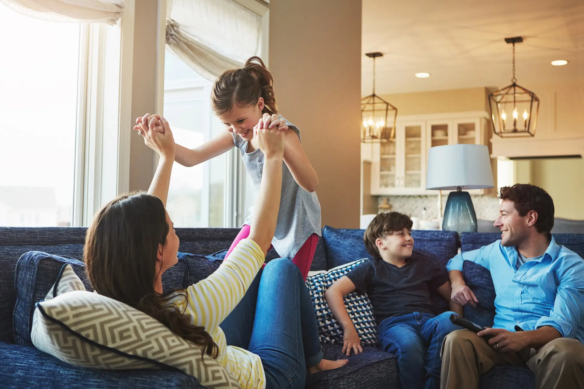 Family relaxing on their couch together