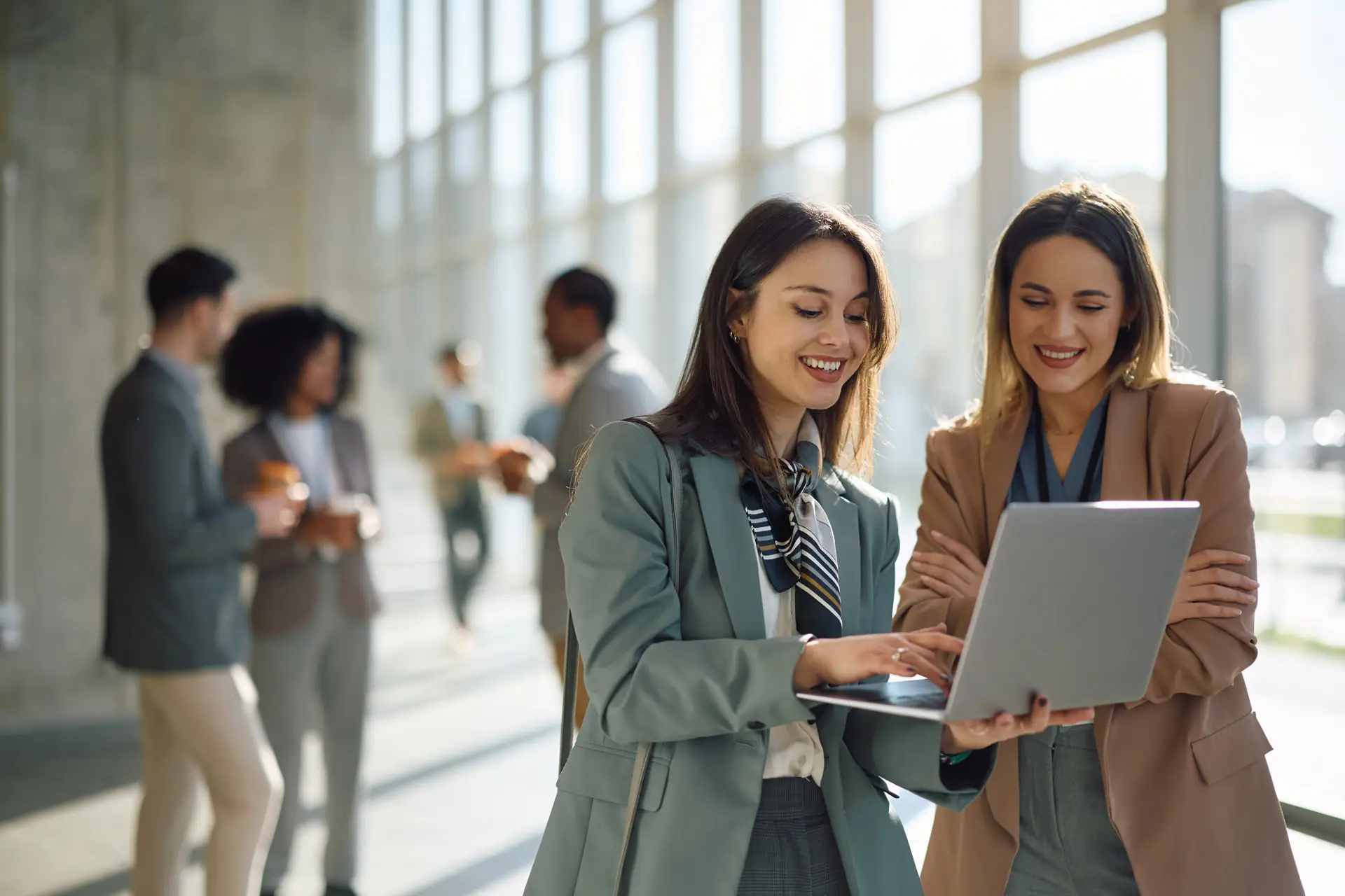 Two women looking at a laptop together