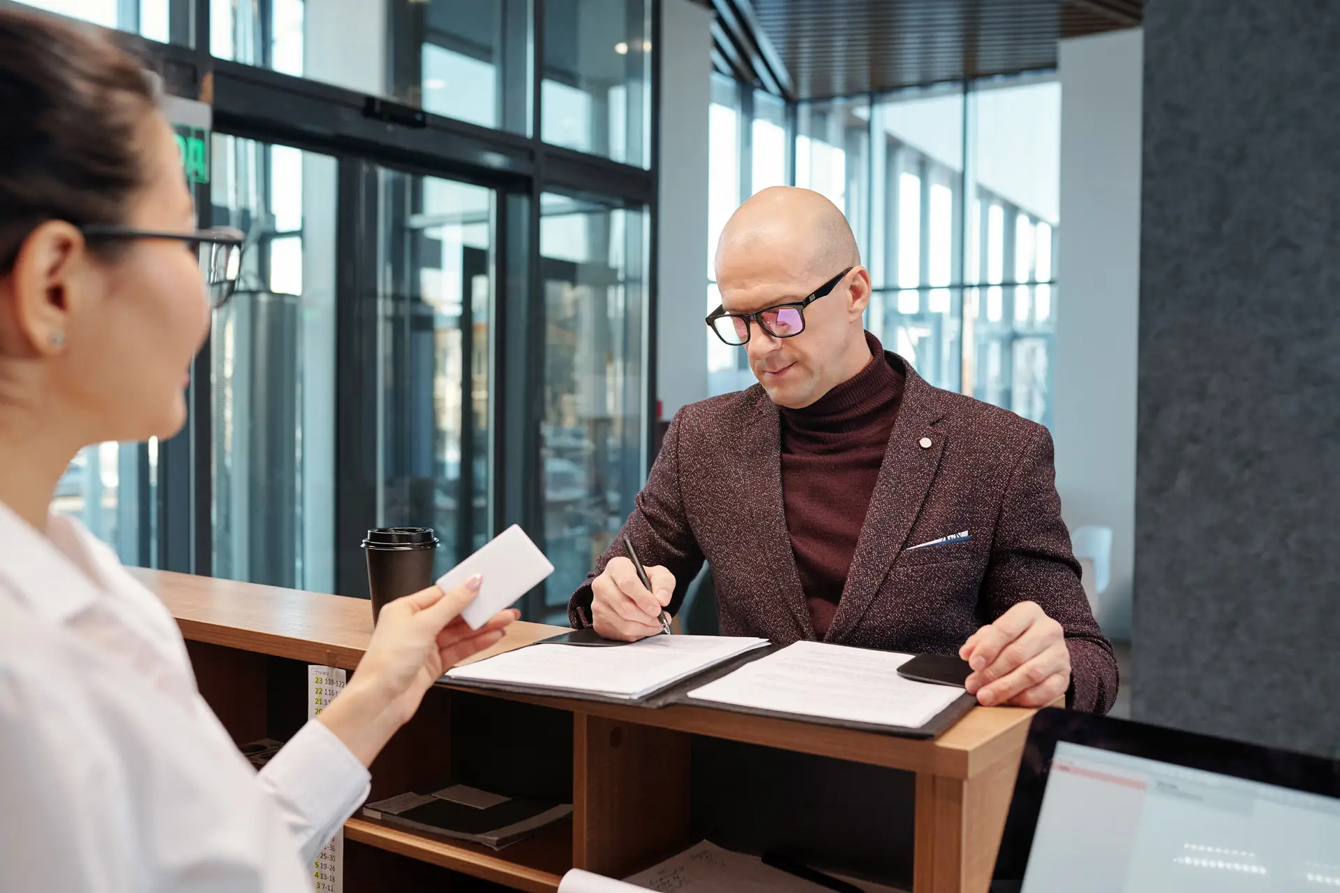 Man filling out a form at a credit union