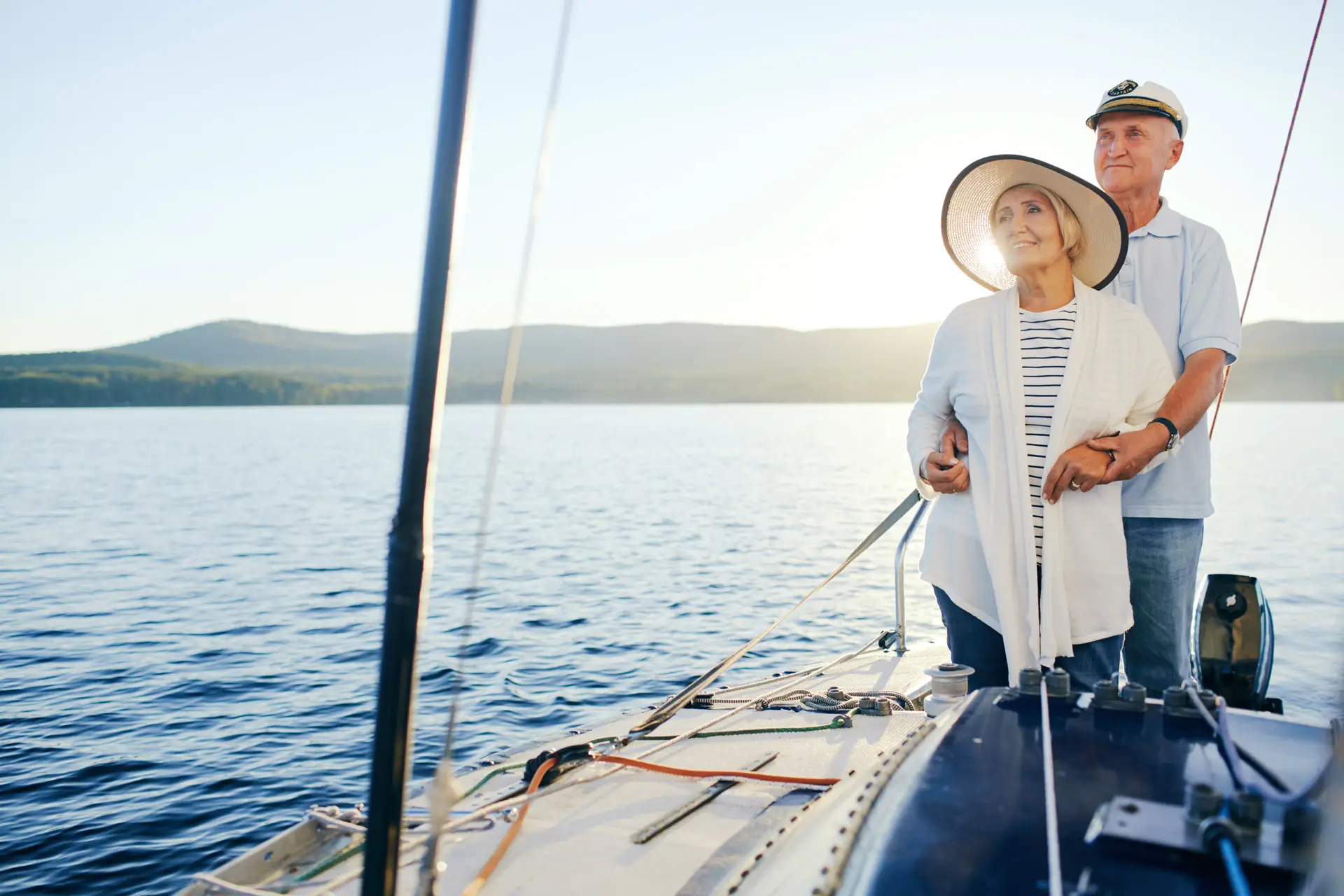 Retired couple embracing on a boat