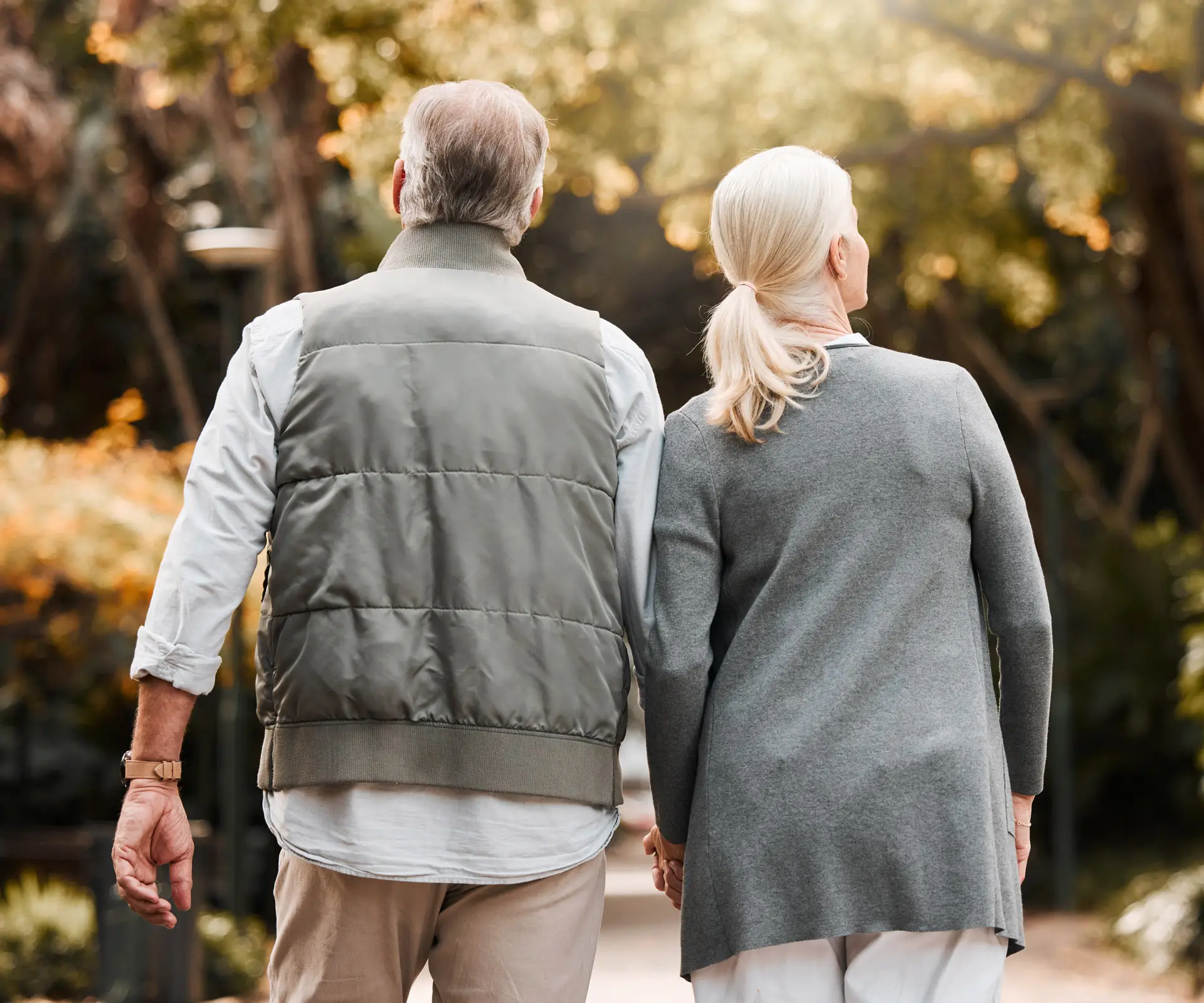 Senior couple walking hand in hand